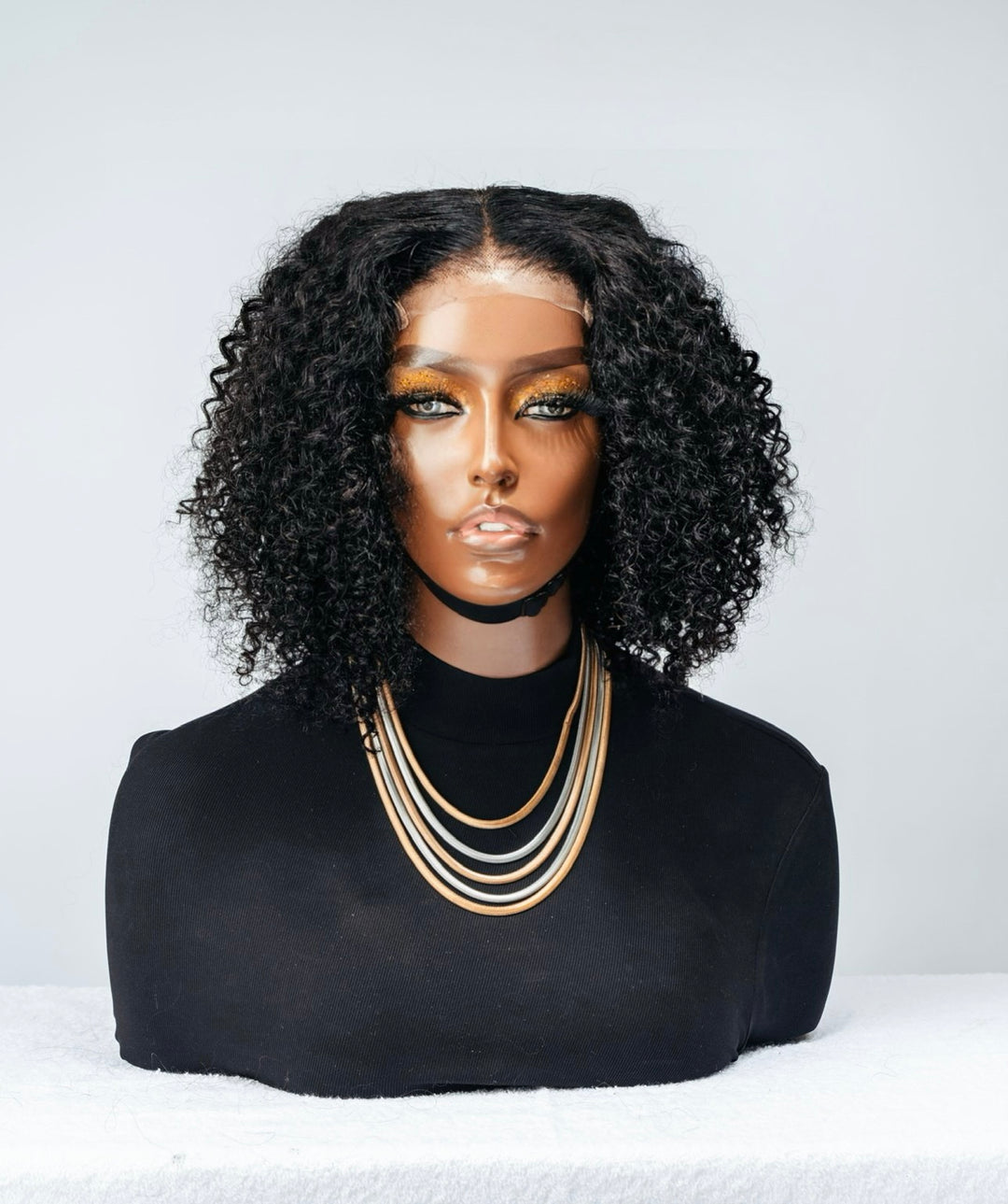 Jerry Curl 4x4 Bob Wig is a glueless unit that has tight coiled curls.