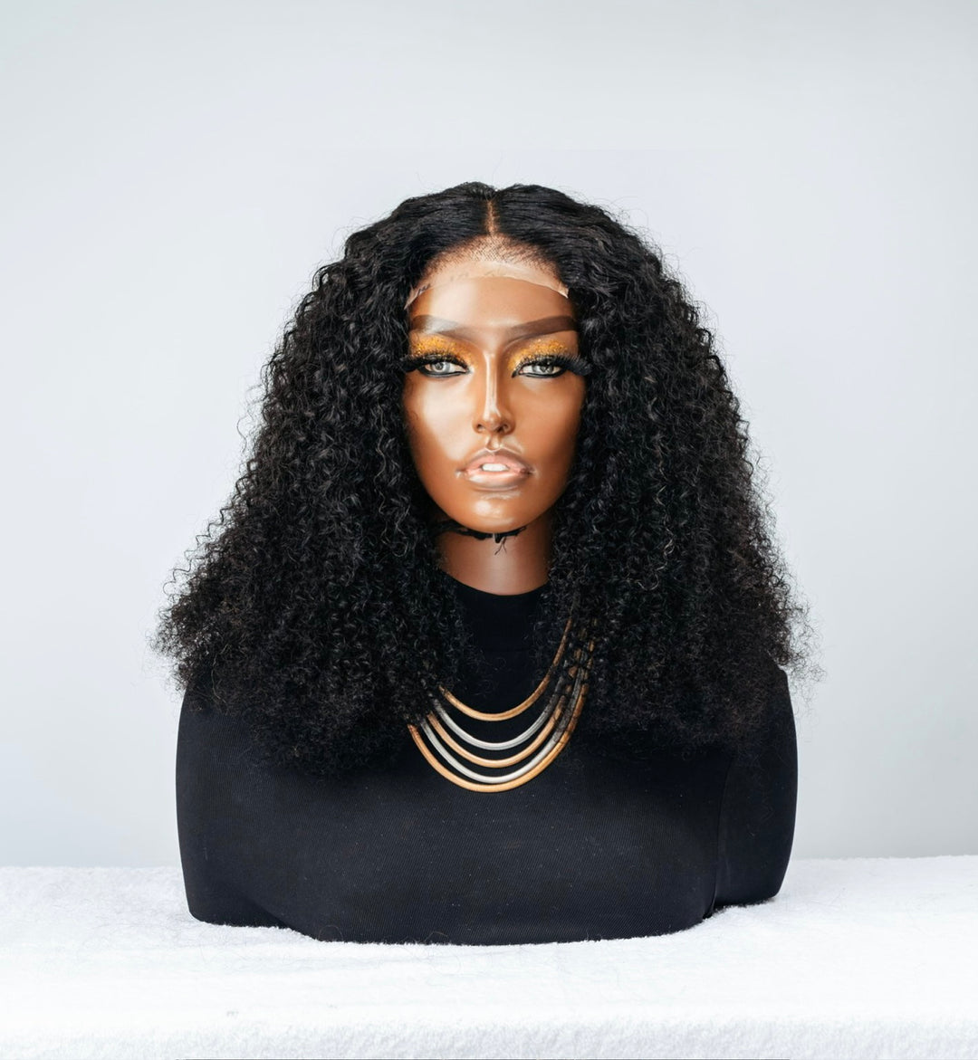 Jerry Curl (4x4 Closure) Wig has tight curls and is a glueless unit.