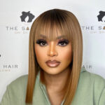Straight Peruvian Bob fringe Copper wig has black roots and is easy to wear. It is a black and blondish ombre wig.
